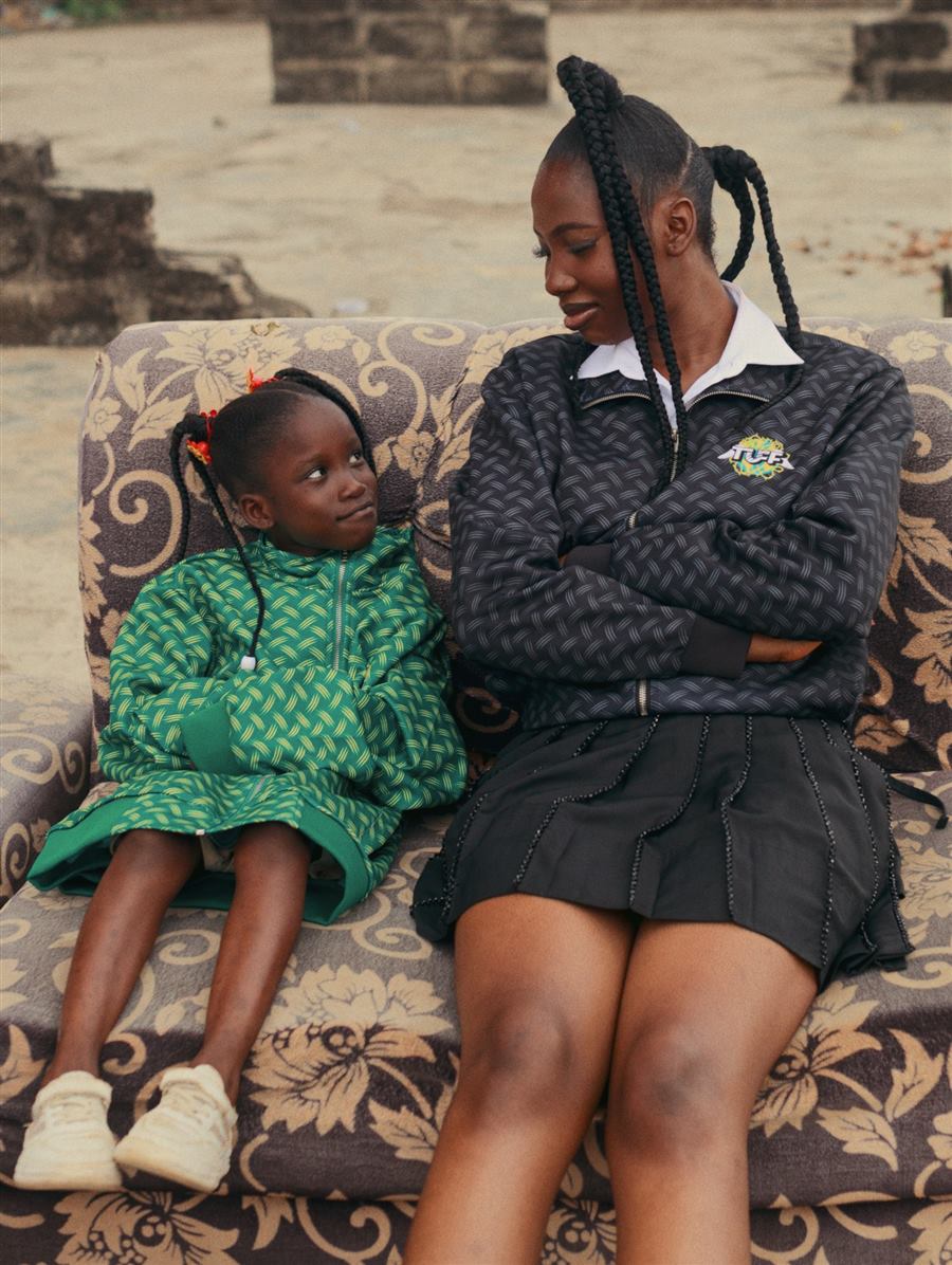 A woman and a child sitting together on a couch